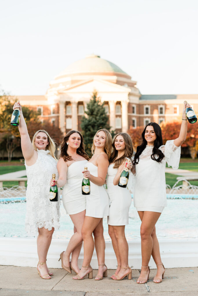SMU sorority friends graduation photo champagne